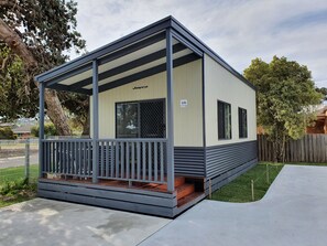 A small, single-story building with a covered porch and a sign reading "Jayco." - BIG4 Whiters Holiday Village (Lakes Entrance)