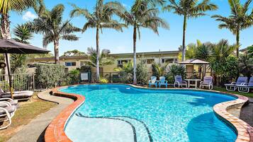 Outdoor pool, open 9:00 AM to 5:00 PM, pool umbrellas, pool loungers