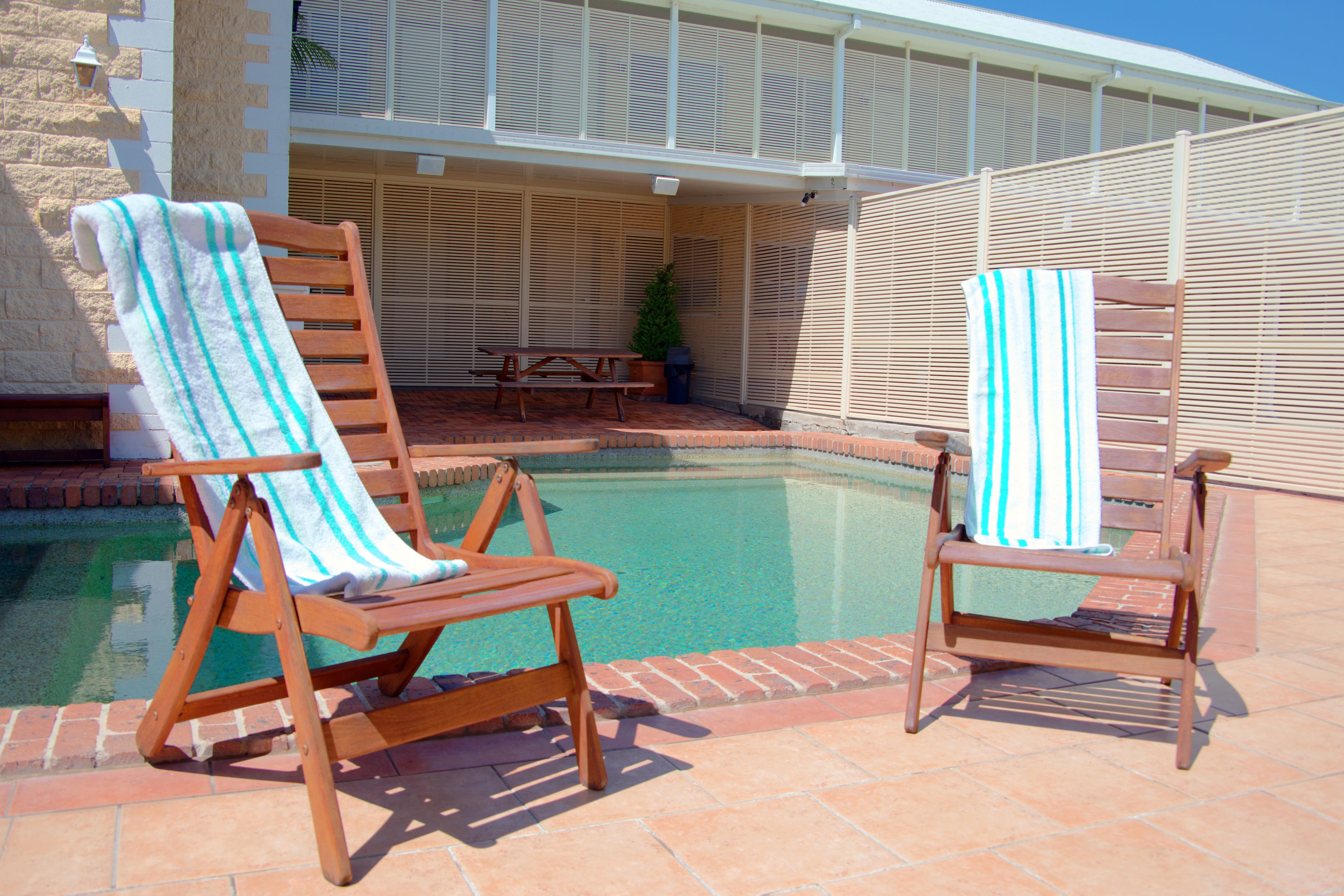 outdoor pool, open 8:00 am to 7:00 pm, pool loungers
