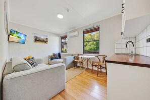 Economy Apartment | Living area | 90-inch TV with digital channels - Bright Velo (Bright)