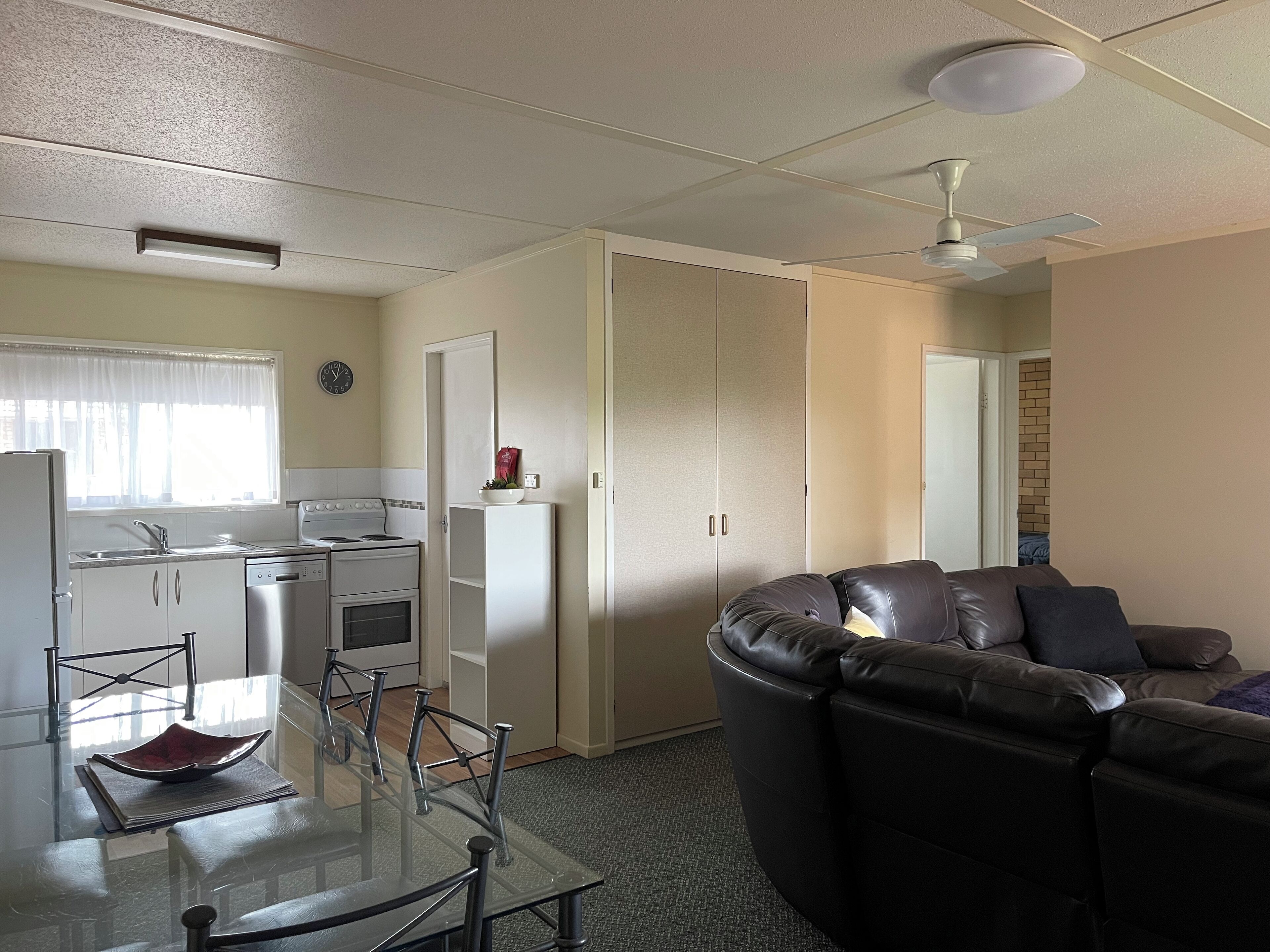 Two Bedroom Apartment with Balcony | Living area | 42-inch Smart TV with cable channels