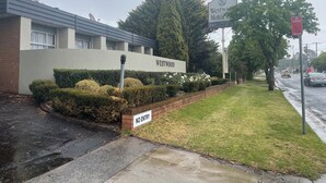 A building with a sign reading "Westwood Motor Inn" and a "NO ENTRY" sign. - Westwood Motor Inn (Armidale)