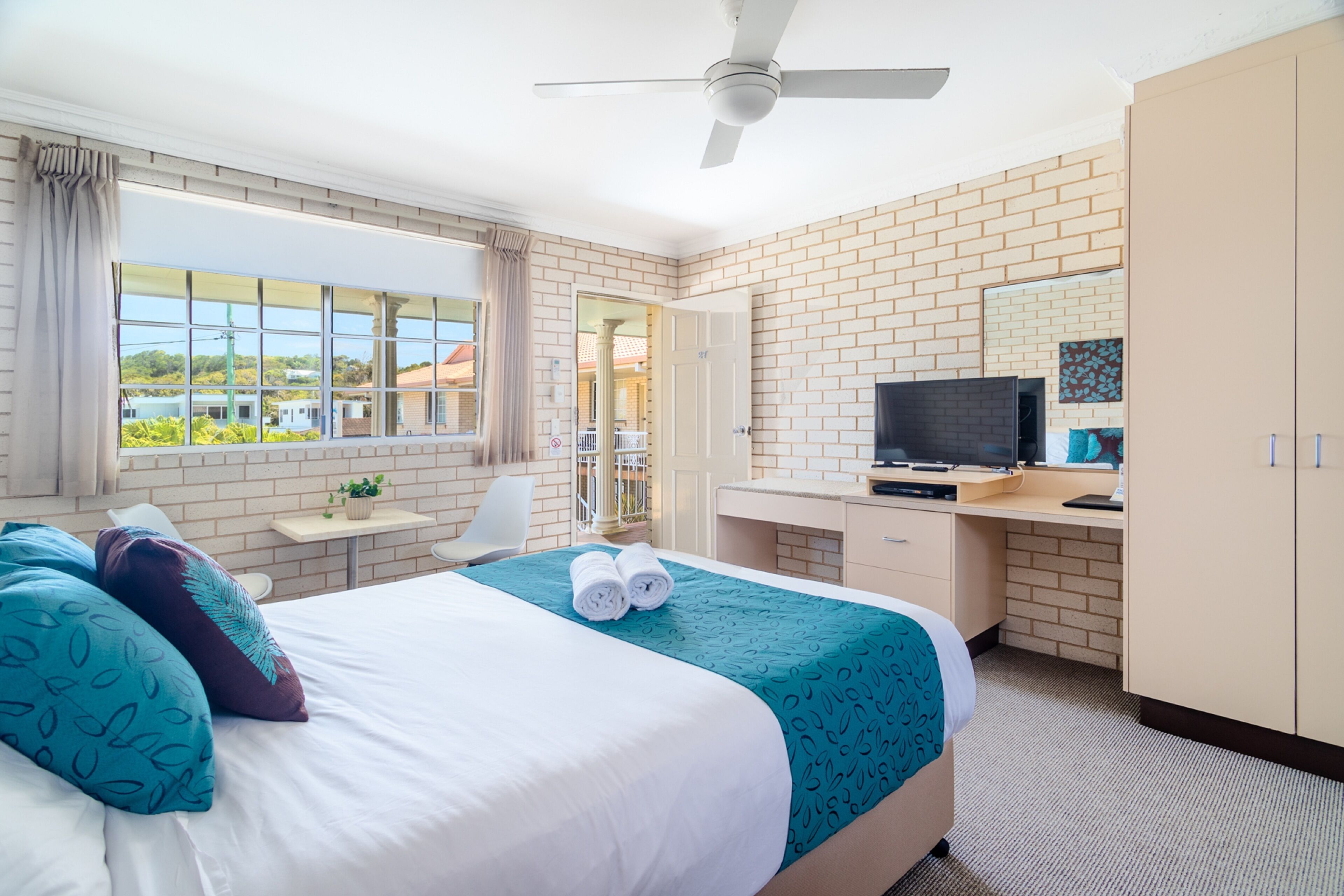 Deluxe Room (Standard Motel Unit) | Premium bedding, desk, laptop workspace, iron/ironing board