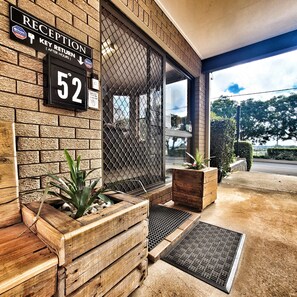 A reception area with a sign indicating 'Reception' and 'Key Return After Hours'.