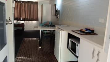 Fridge, microwave, electric kettle, cookware/dishes/utensils