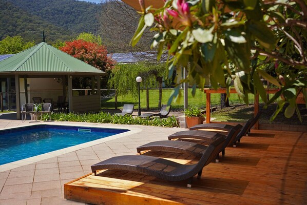 Outdoor pool, open 8:00 AM to 8:00 PM, pool umbrellas, pool loungers