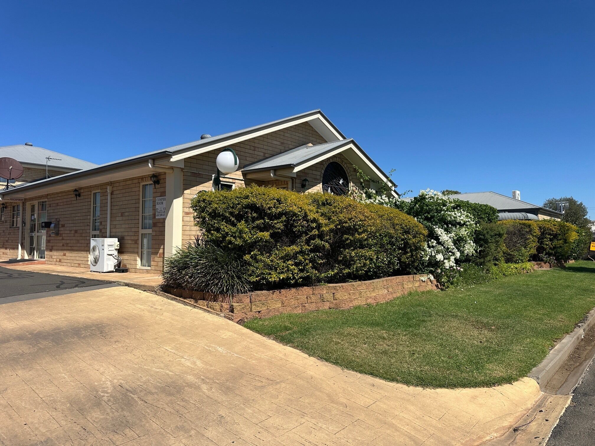 A building with a reception area, a conference room, and a satellite dish.