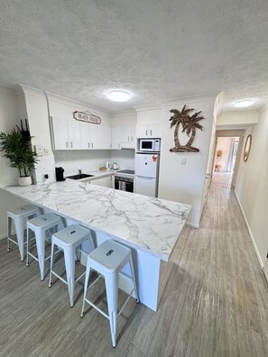 Modern Design Three Bedroom Apartment with Private Balcony | Living area | Flat-screen TV, DVD player