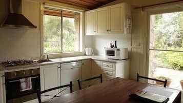 Full-sized fridge, microwave, stovetop, coffee/tea maker