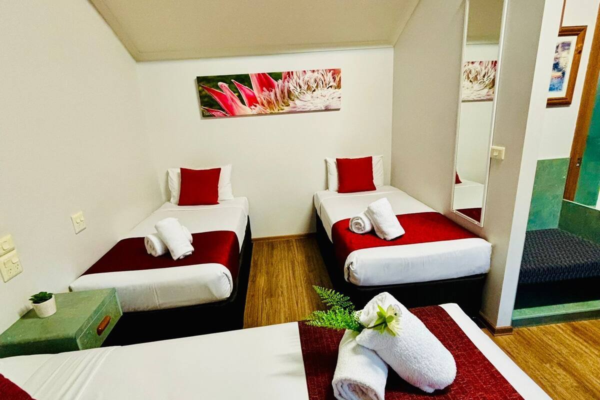 Family Kitchenette Room | Desk, blackout drapes, iron/ironing board, free WiFi