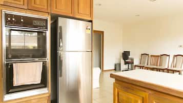 Four Bedroom Cottage | Private kitchen | Full-size fridge, microwave, oven, stovetop