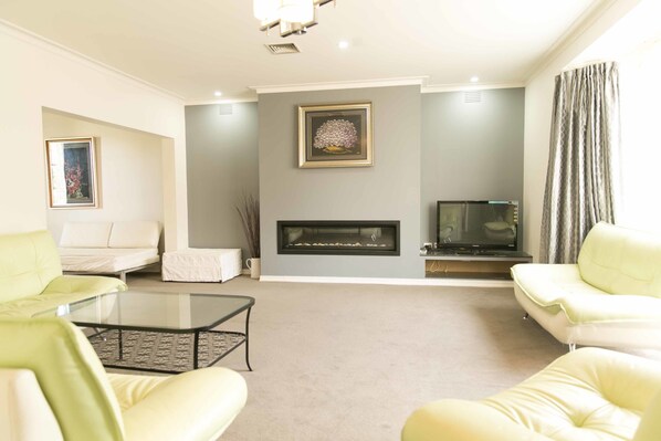Four Bedroom Cottage | Living room | Flat-screen TV, fireplace, DVD player - Hawthorn Holiday House (Hawthorn)