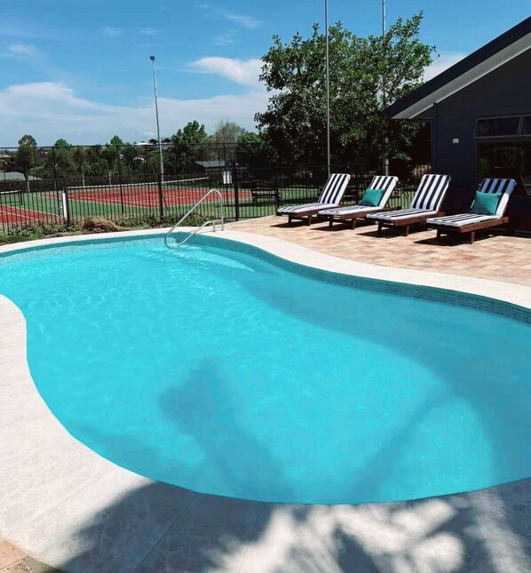 Outdoor pool, open 8:00 AM to 8:00 PM, pool umbrellas, pool loungers