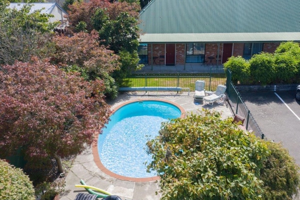 Seasonal outdoor pool, pool umbrellas, pool loungers