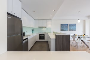 Family Apartment, 3 Bedrooms | Private kitchen | Mini-fridge, microwave, oven, stovetop