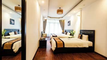 Family Suite | Minibar, in-room safe, blackout drapes, free WiFi