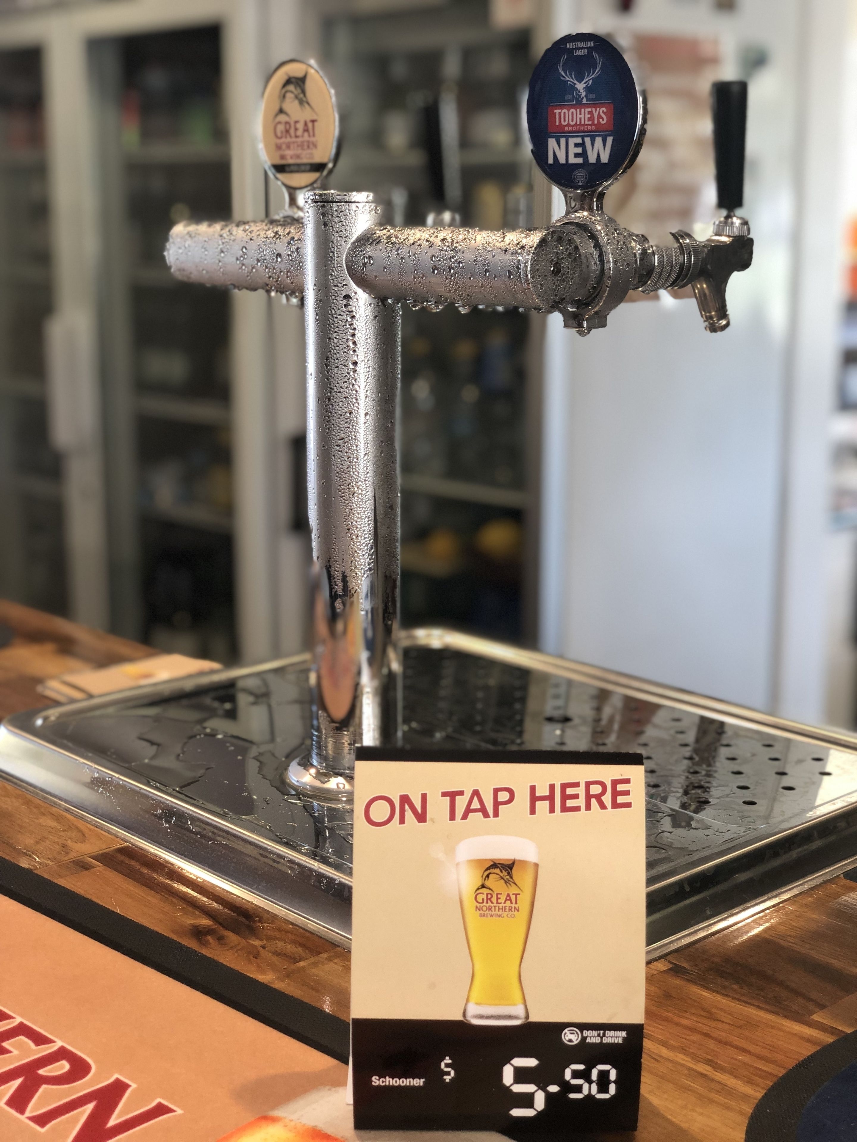 A tap with two beer spigots labeled "Great Northern" and "Toheys Brothers New".