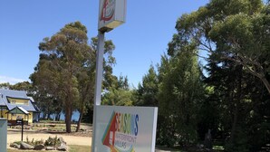 A sign for Seasons Waterfront Villas with a phone number and a 'No Vacancy' label. - Four Seasons Waterfront Villas (Taranna)
