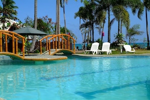 Outdoor pool, open 8 AM to 8 PM, pool loungers