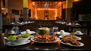 Breakfast, lunch served; local and international cuisine, garden views 