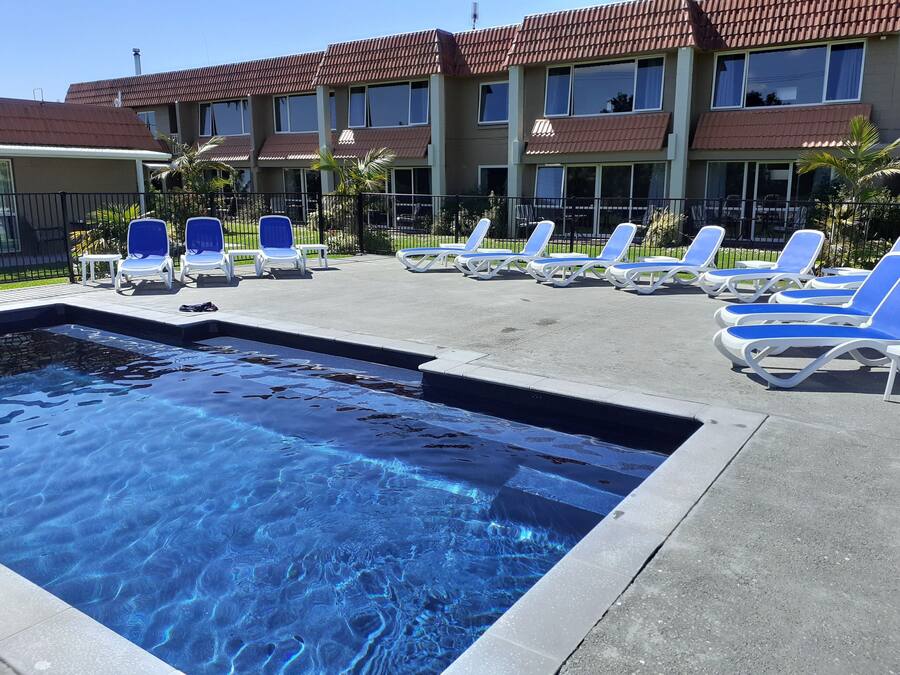 2 outdoor pools, open 8:00 AM to 9:00 PM, pool umbrellas, pool loungers