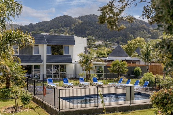 2 outdoor pools, open 8:00 AM to 9:00 PM, pool umbrellas, pool loungers