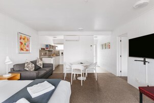 One Bedroom Apartment (with Aircon) | Living area | 50-inch Smart TV with digital channels, TV, Netflix