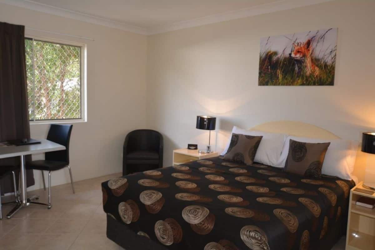 Desk, laptop workspace, iron/ironing board, travel cot