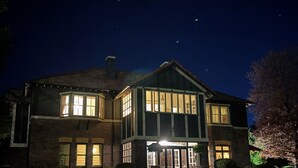 A two-story house with a large front porch and multiple windows. - Lindsay House Guesthouse (Armidale)