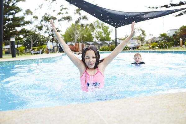 Outdoor pool, a heated pool, pool loungers