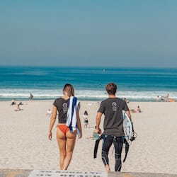 Beach nearby, white sand, beach umbrellas, beach towels