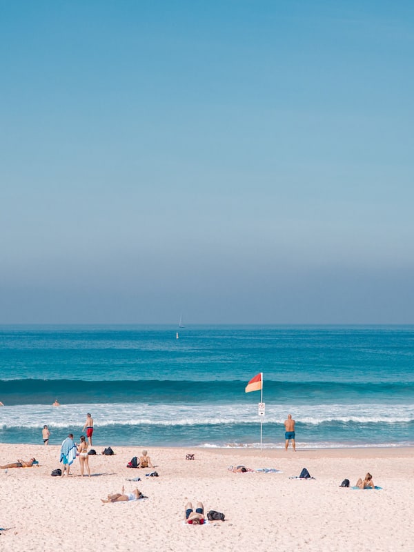 Beach nearby, white sand, beach umbrellas, beach towels