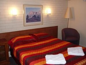 Standard Room, Non Smoking (Double / Queen Room) | Blackout drapes, iron/ironing board, free WiFi, bed sheets