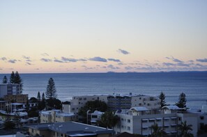 A coastal cityscape with buildings and a view of the sea. - Mariners Resort (Kings Beach)