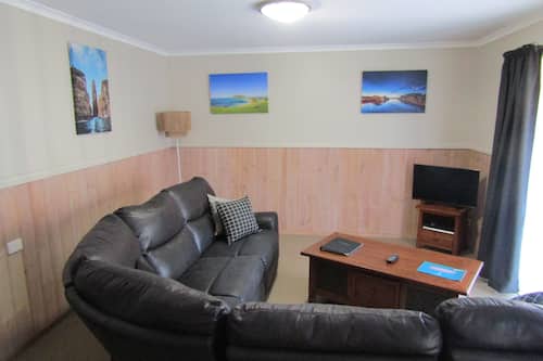 Standard Apartment, 2 Bedrooms, Kitchen (Apt Unit 5) | Living area | 58-inch flat-screen TV with digital channels, TV, DVD player