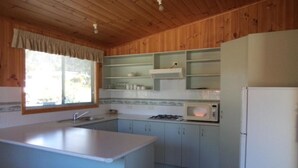Cottage, 2 Bedrooms, Kitchen | Private kitchen | Coffee/tea maker, full-sized fridge, microwave, stovetop - Bicheno East Coast Holiday Park (Bicheno)
