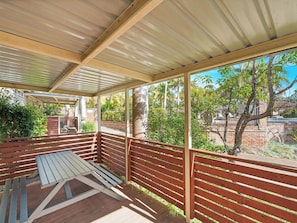 A covered outdoor area with wooden benches and a metal roof. - BIG4 Happy Hallidays Holiday Park (Hallidays Point)