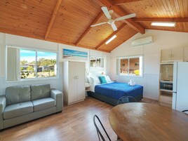 Standard 1 Bedroom Cabin | Living area | TV