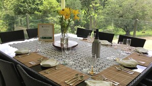A dining table set for six with a view of a lush green landscape. - Ingleside Stud Farm (Tallebudgera Valley)