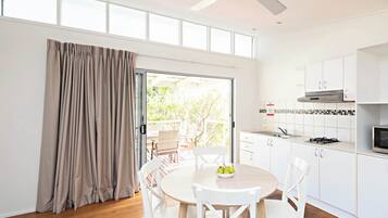 Sea Breeze Villa | Private kitchenette | Full-sized fridge, microwave, stovetop, electric kettle