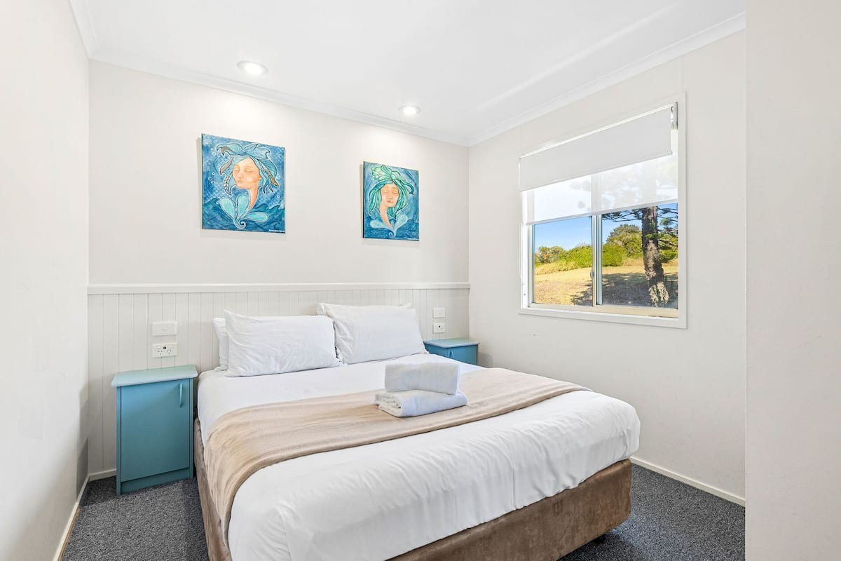 Ocean Breeze Villa | Iron/ironing board, free cribs/infant beds, bed sheets