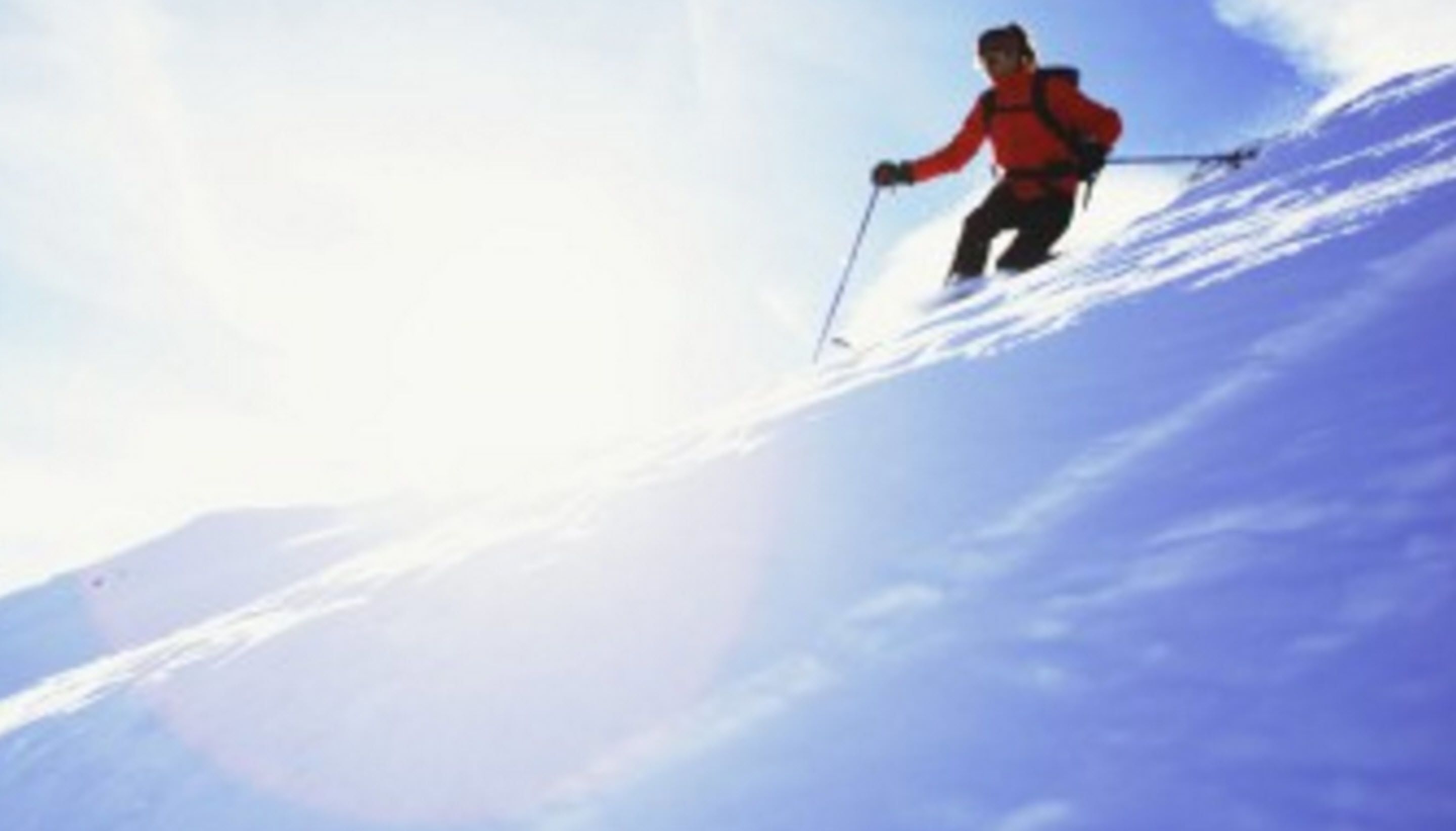 A person skiing on a snowy slope.