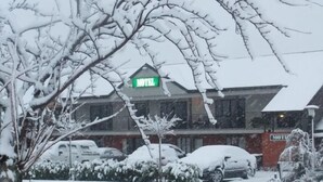 A hotel with a visible sign indicating it is a hotel. - Darfield Motel (Darfield)