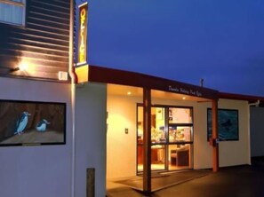 A building with a sign reading "Dunton Bay Hotel." - Dunedin Holiday Park & Motels (Dunedin)