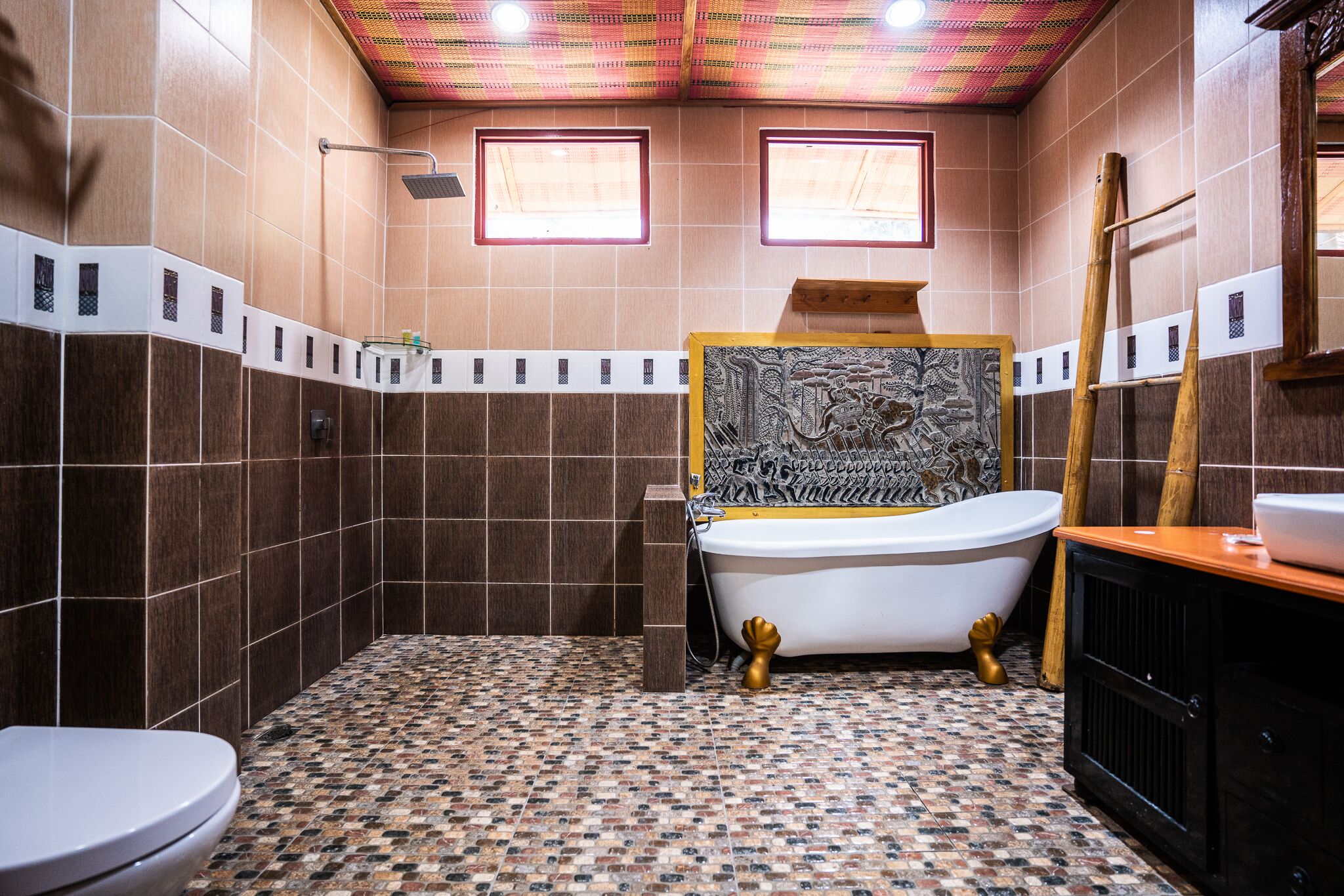A bathroom with a bathtub, a toilet, and a shower.