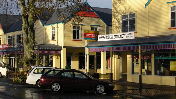 A row of buildings with a sign for 'No. 1 Hotels' and 'Trendz Books & Stationery'. - No1 Motels On Victoria (Cambridge)