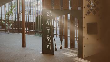 A metal structure with the letters "ENTRY" on it, suggesting a gate or entrance.