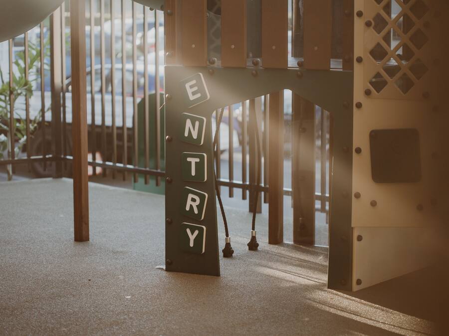 A metal structure with the letters "ENTRY" on it, suggesting a gate or entrance.