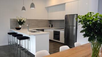 Oven, stovetop, electric kettle, cookware/dishes/utensils