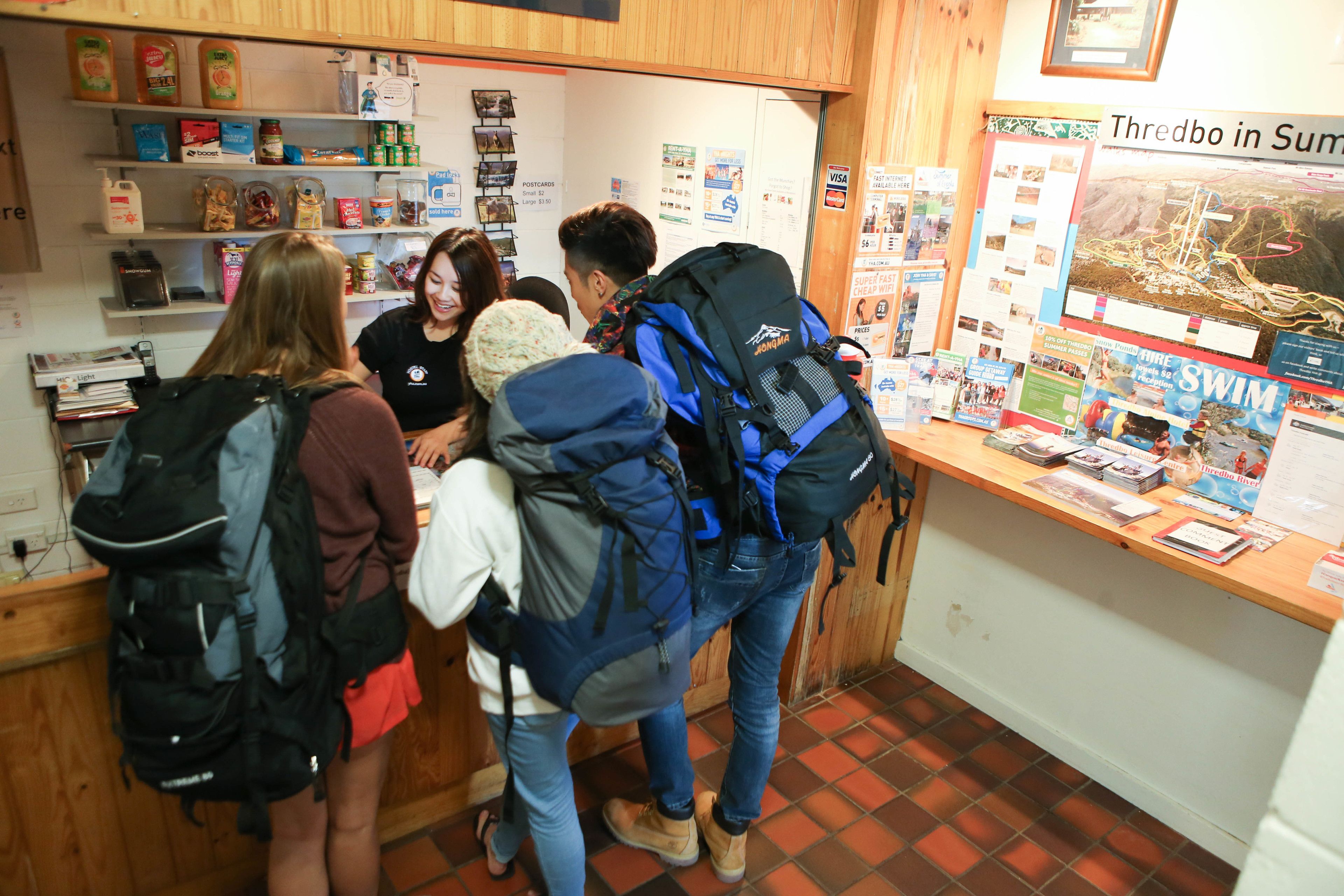 A reception area with a counter, informational posters, and a bulletin board.